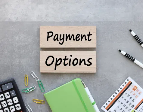 Payment options written on block on a desk